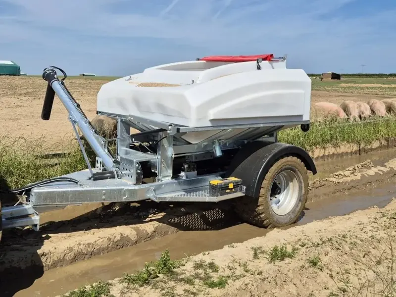 3T Easy-Feed trailer being pulled by tractor
